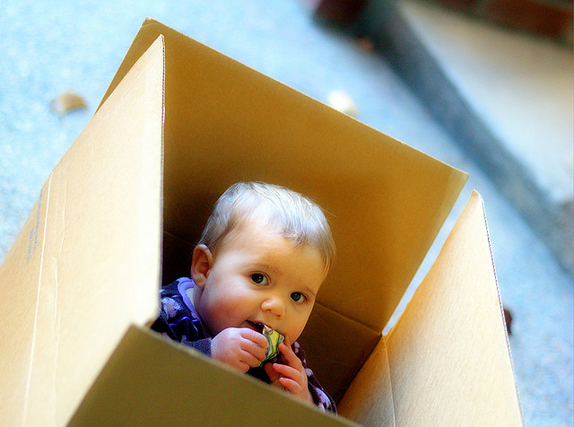 Baby sitting in box